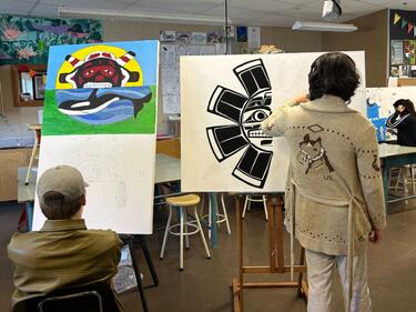 Two students work on their final project for the Abby Senior Art Activism.